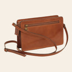 Borsetta clutch in pelle marrone con tasca frontale con zip e tracolla lunga