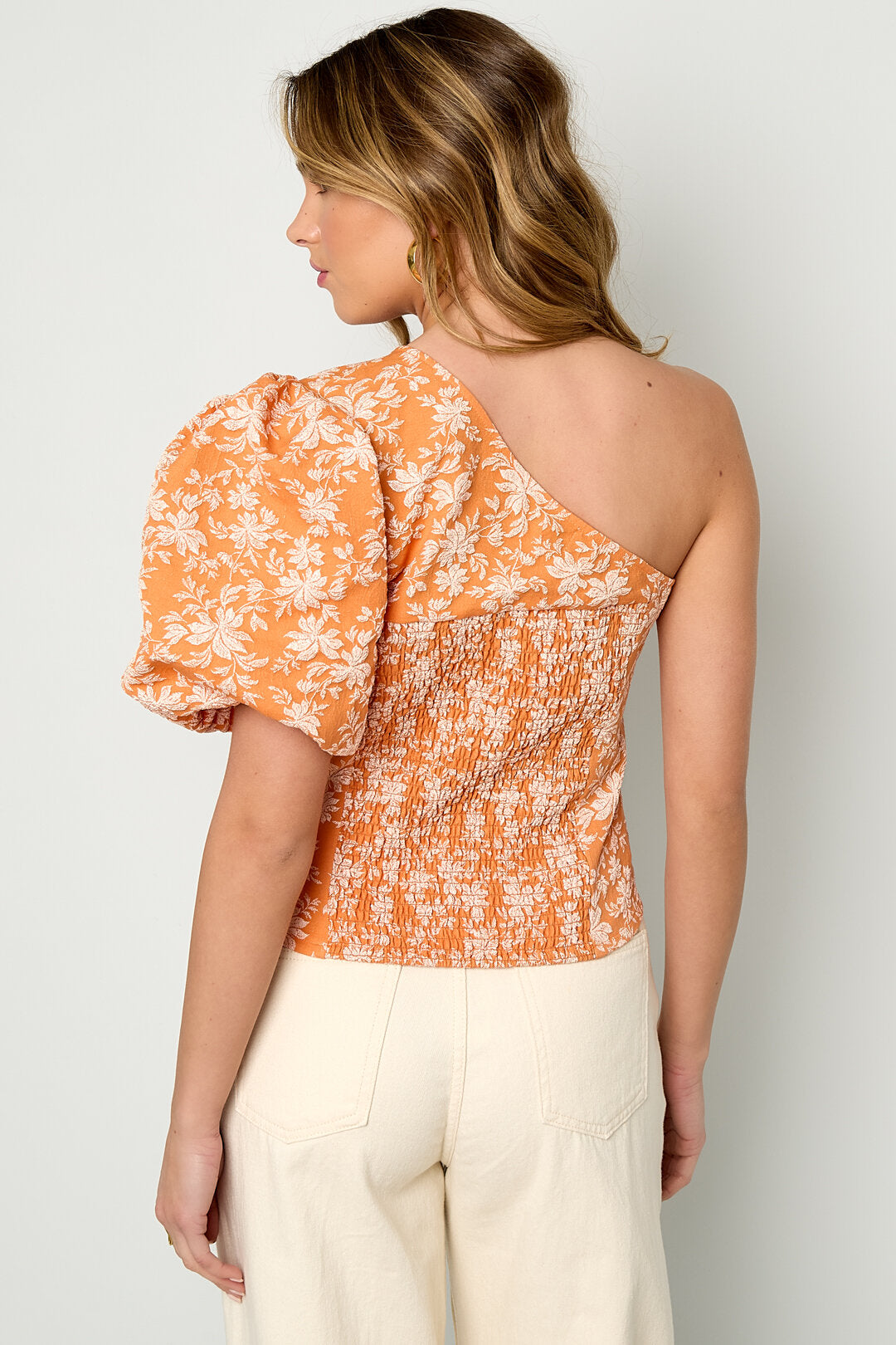 Top a fiori monospalla
