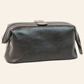 Astuccio beauty in pelle nera con maniglia superiore e zip perimetrale