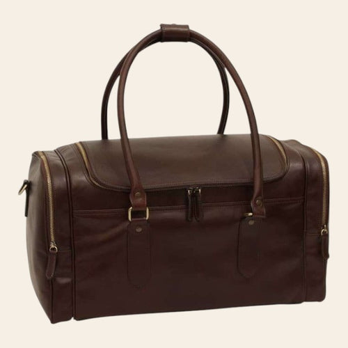 Borsa da viaggio in pelle marrone scuro con manici alti e zip laterali, dettagli in ottone