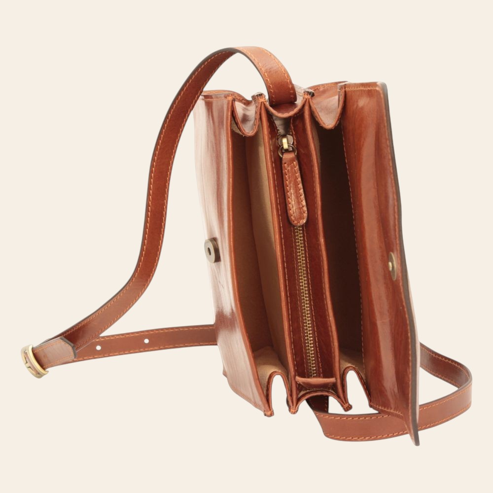 Borsa a tracolla in vitello pieno fiore marrone con interno visibile e zip centrale.
