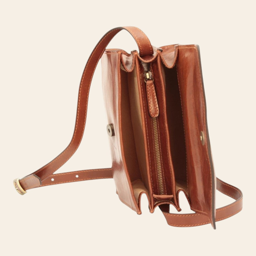 Borsa a tracolla in vitello pieno fiore marrone con interno visibile e zip centrale.