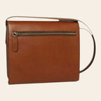 Borsa in pelle color teak con zip superiore e tasca esterna, tracolla.