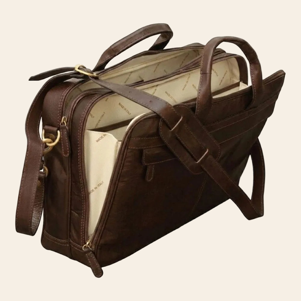 Borsa per laptop in pelle scura con tracolla e tasca frontale con zip