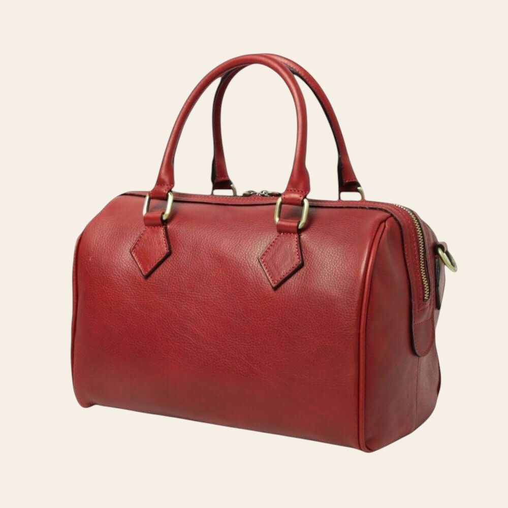 Bauletto in pelle rossa con manici rigidi e zip laterale.