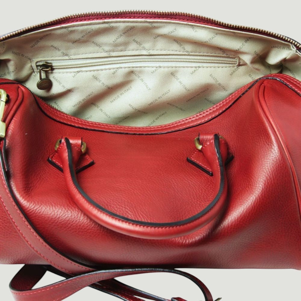 Bauletto in pelle rossa con doppia maniglia e zip superiore, interno con tasca