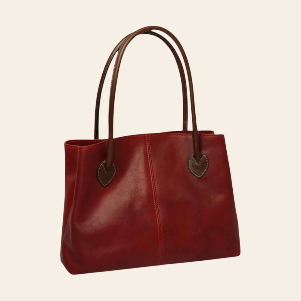 Borsa a spalla in pelle rossa con manici marroni e cuciture verticali in evidenza