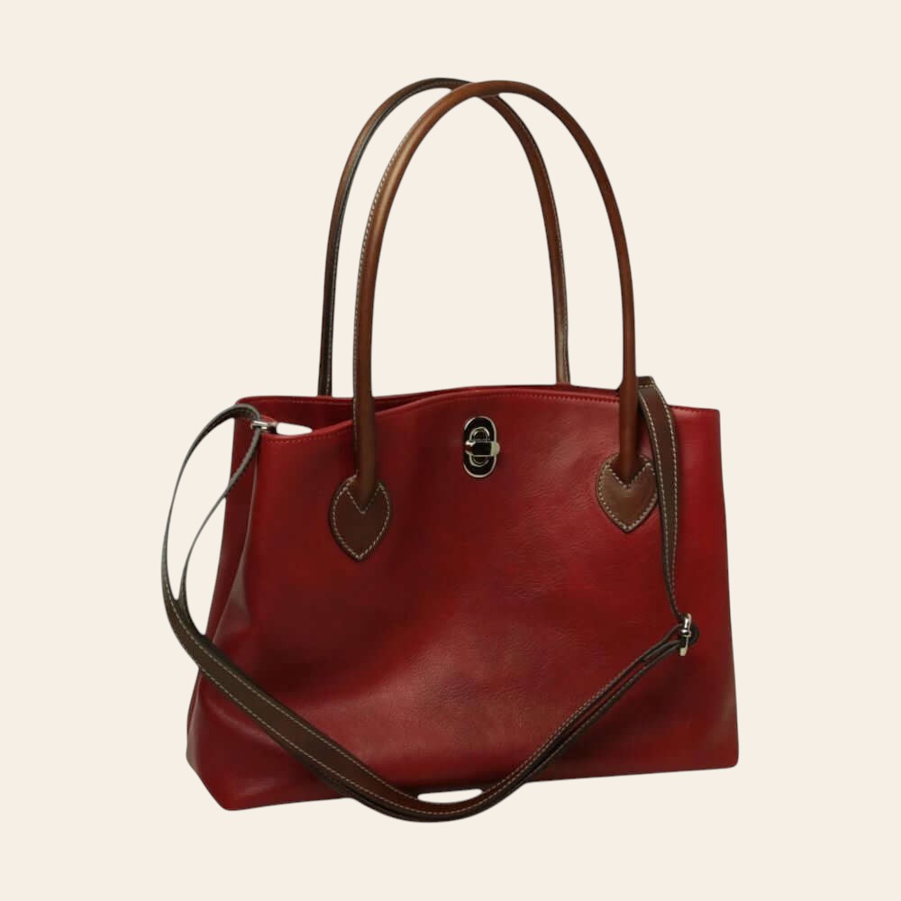 Borsa a spalla in pelle rossa con manici marroni e dettaglio metallico frontale