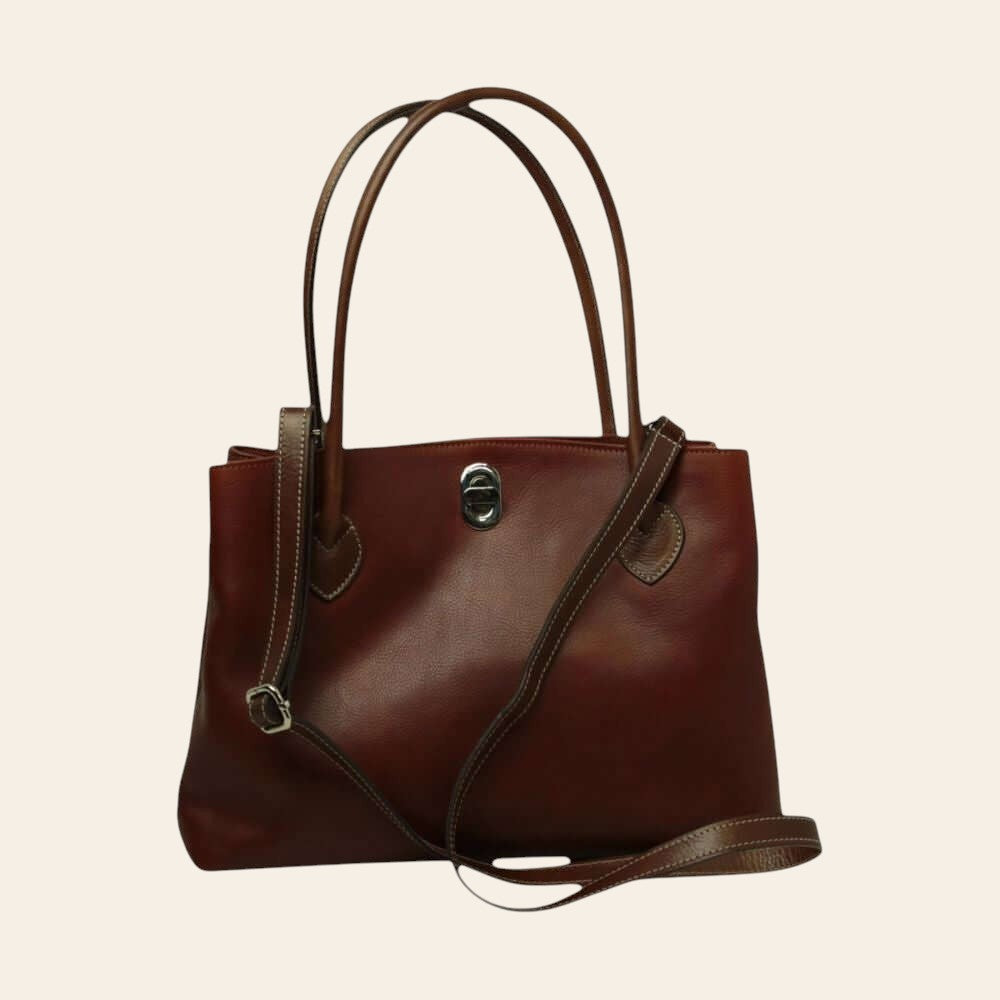 Borsa in pelle bicolore con due manici alti e chiusura frontale con logo