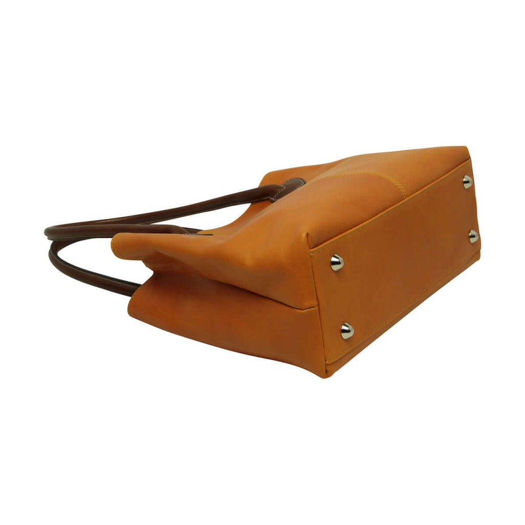 Borsa donna bicolore pelle vista laterale con manici e base rinforzata, in pelle gialla ocra.