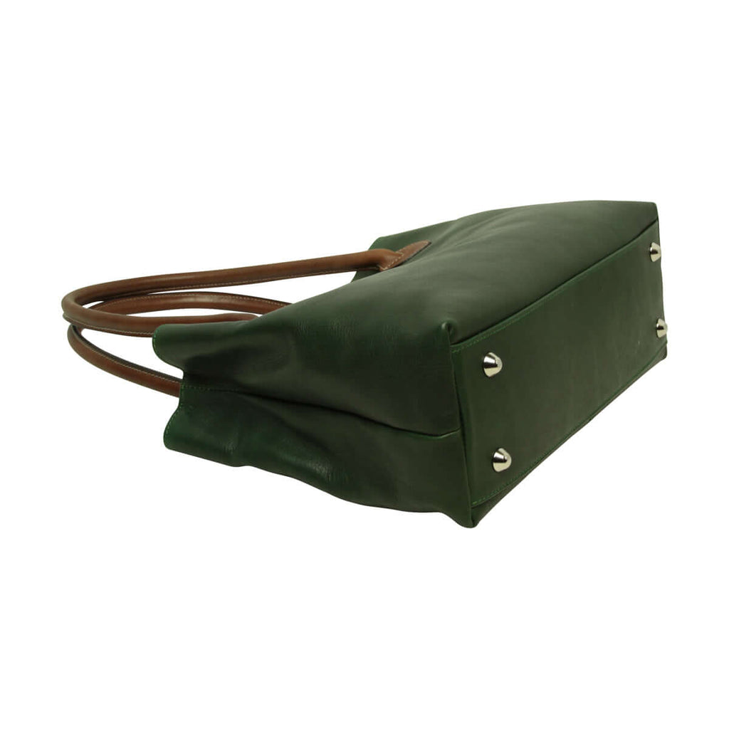 Borsa donna pelle bicolore vista laterale, con manici in pelle, chiusura con girello e dettagli in metallo.