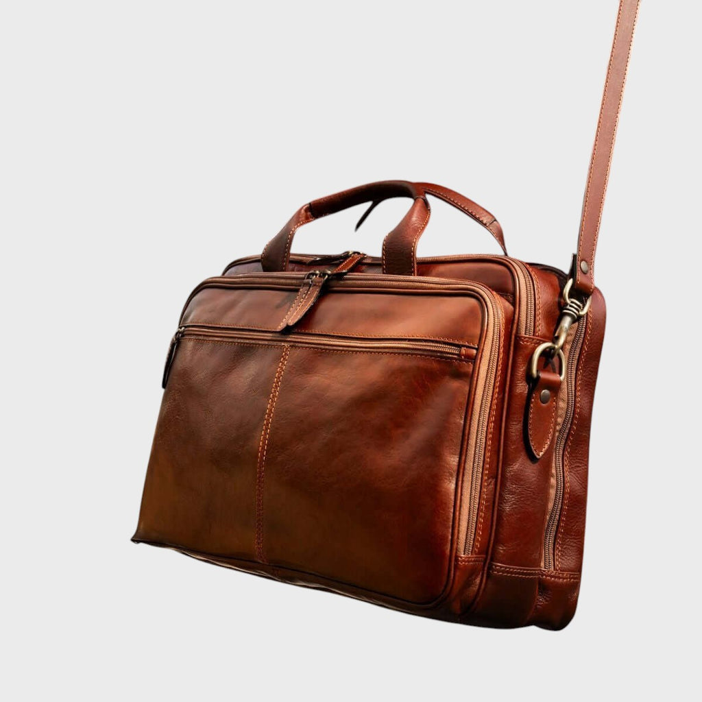 Borsa laptop in pelle marrone con tracolla e manici superiori