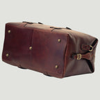 Borsone viaggio marrone in vacchetta con occhielli e bottoni metallici laterali