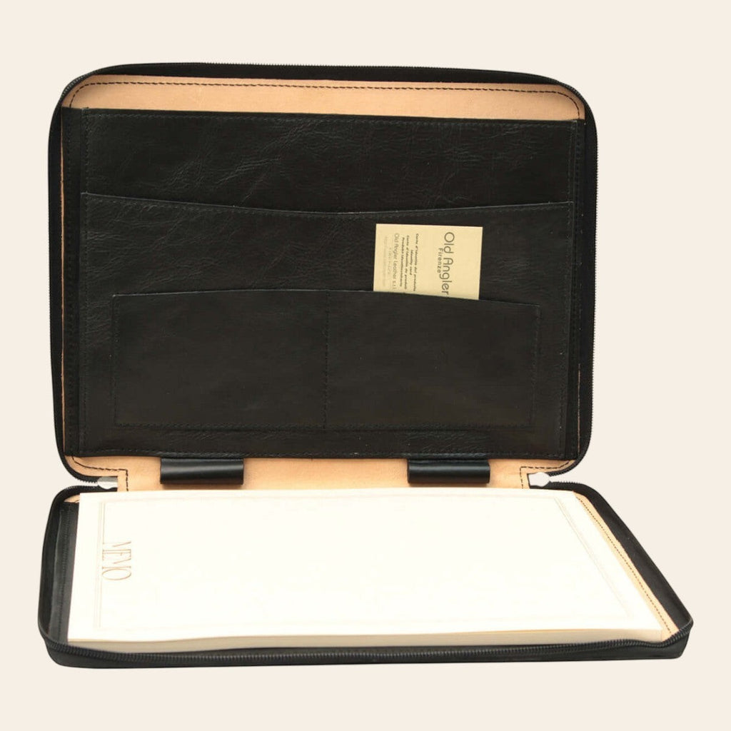 Porta documenti in pelle nero aperto con fodera beige e superficie bianca estraibile