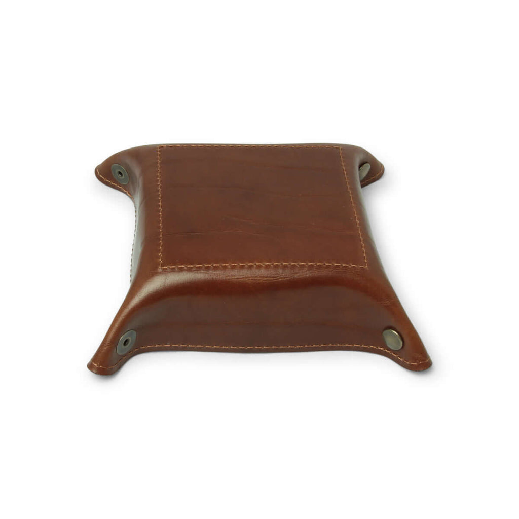 Vuotasche in pelle marrone con sponde arrotondate e occhielli agli angoli, vista laterale