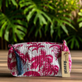 pochette viaggio fucsia palm Roary Pouches con stampa palme e fodera impermeabile.