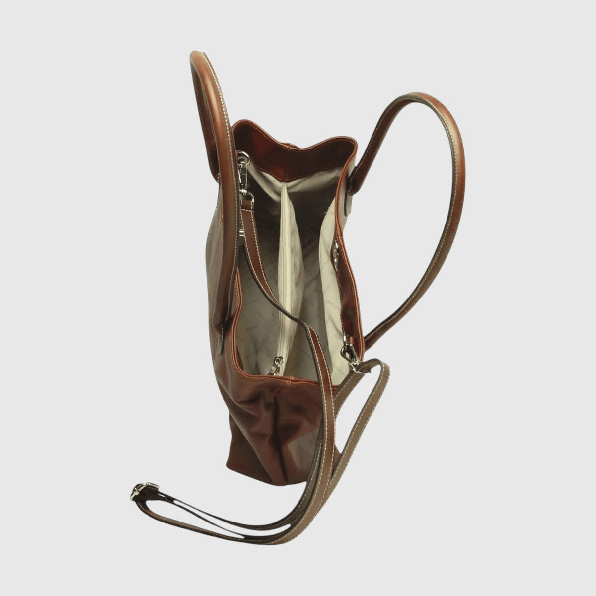 Borsa in pelle mogano con fodera chiara, apertura con zip e vista interna laterale