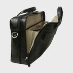 Borsa in pelle nera per laptop aperta, interno beige e dettagli con zip