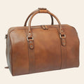 Borsa da viaggio in pelle di vitello color castagna, vista frontale con doppi manici, zip superiore e dettagli metallici