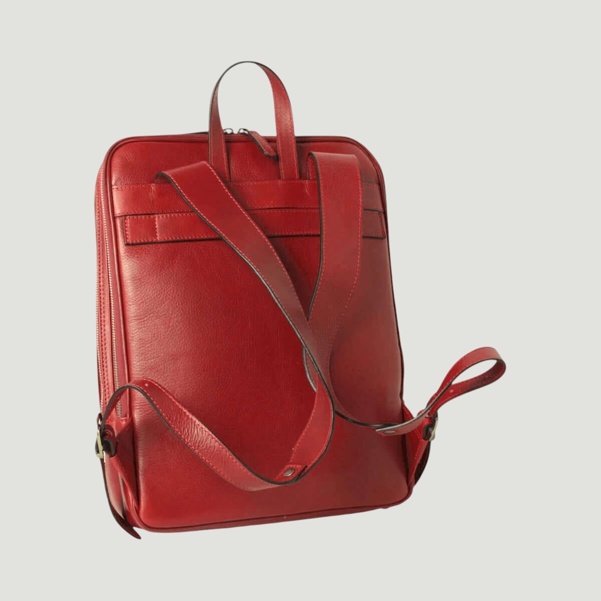 Zaino in pelle rossa con spallacci regolabili e zip laterale, chiusure metalliche