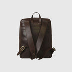Zaino in pelle di vitello marrone scuro con spallacci regolabili e manico trolley
