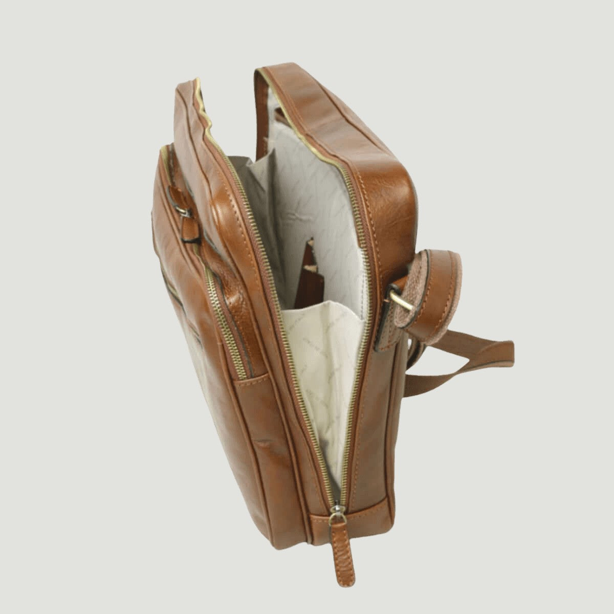 Borsa messenger in pelle marrone, vista laterale con fodera chiara e zip principali
