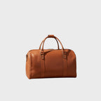 Borsa da viaggio in pelle pieno fiore cuoio, manici imbottiti e chiusura a zip.