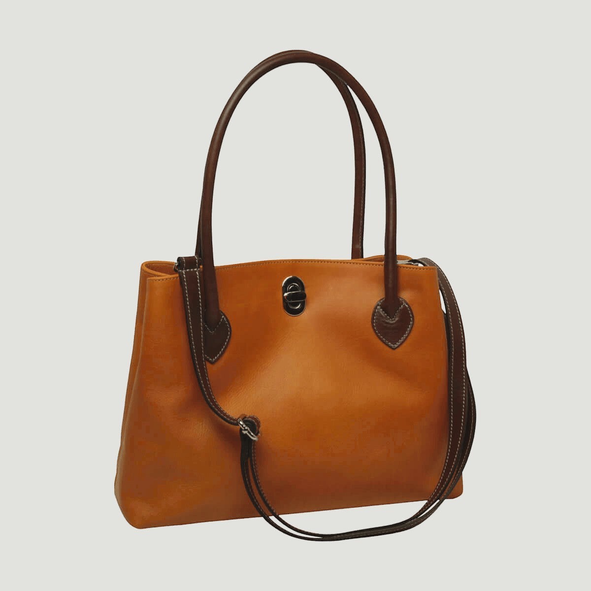 Borsa in pelle giallo ocra con due manici, stemma centrale e passante marrone