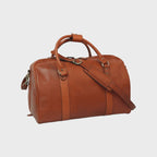 Borsa da viaggio in pelle pieno fiore cuoio con tracolla regolabile e fibbie metalliche.