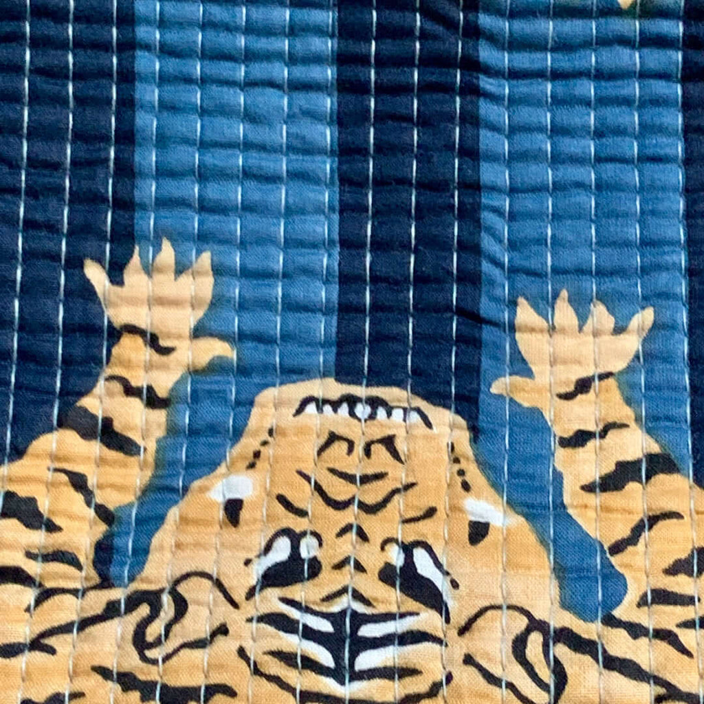 Pochette da Viaggio Roary Pouches Tigers on Blue fabric featuring bold tiger pattern on blue background.