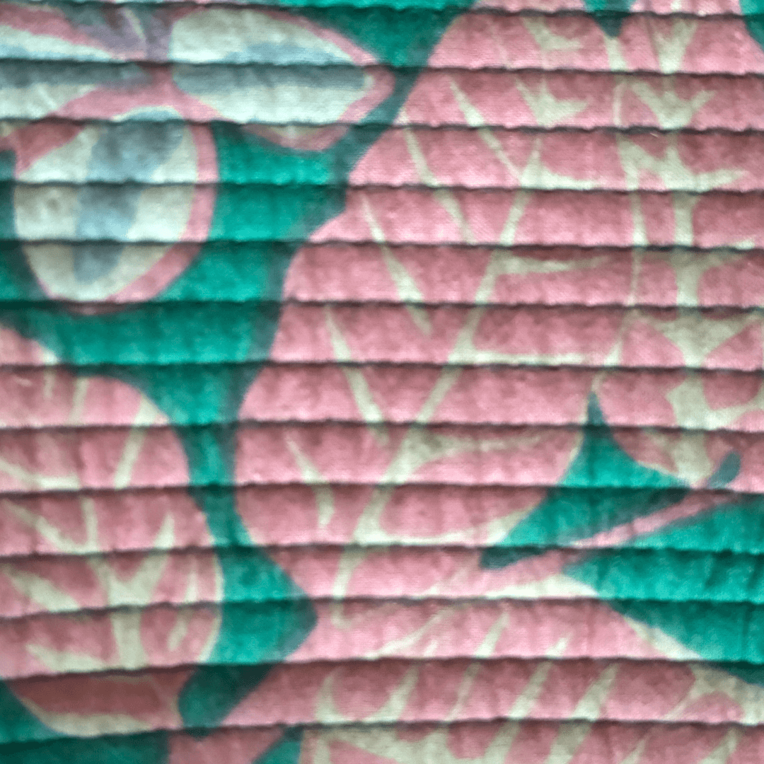 Roary Pouches 🐾 Maldives in vibrant floral patterns, displayed on a wooden surface with tropical greenery.