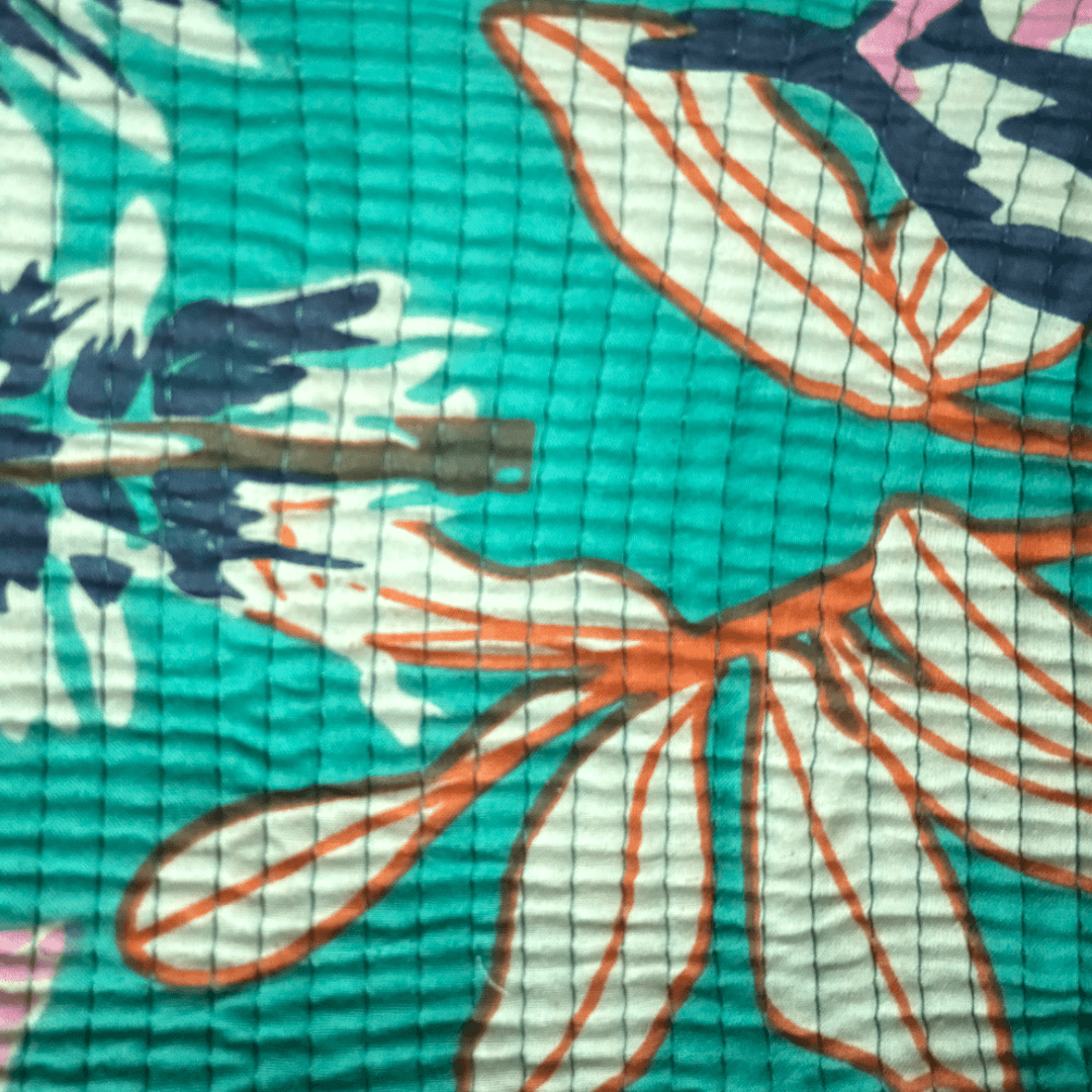Roary Pouches 🐾 Maldives in vibrant floral patterns, displayed on a wooden surface with tropical greenery.