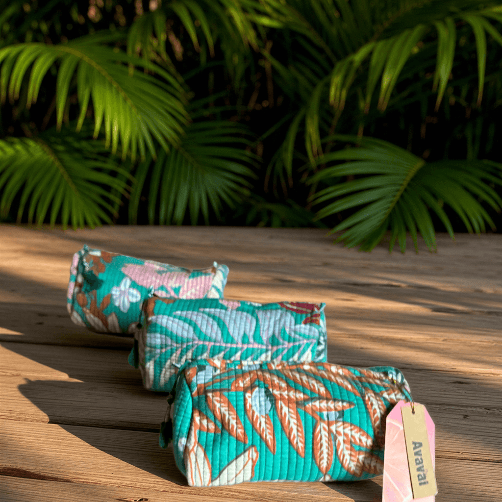 Roary Pouches 🐾 Maldives in vibrant floral patterns, displayed on a wooden surface with tropical greenery.