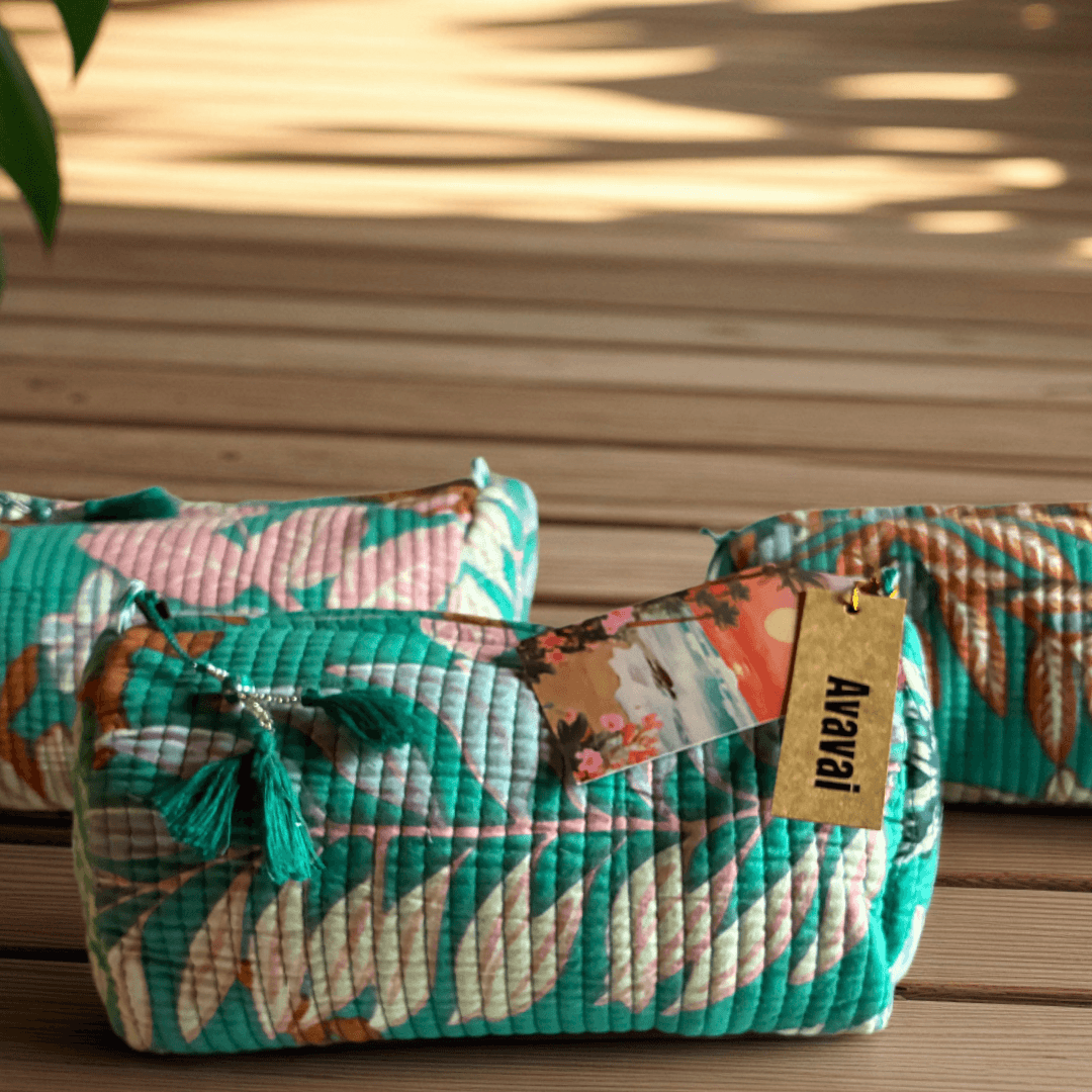 Roary Pouches 🐾 Maldives in vibrant floral patterns, displayed on a wooden surface with tropical greenery.