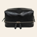 Beauty case Vetrina Fiorentina in pelle nera con doppio scomparto e chiusura a zip, realizzato a mano in Italia.