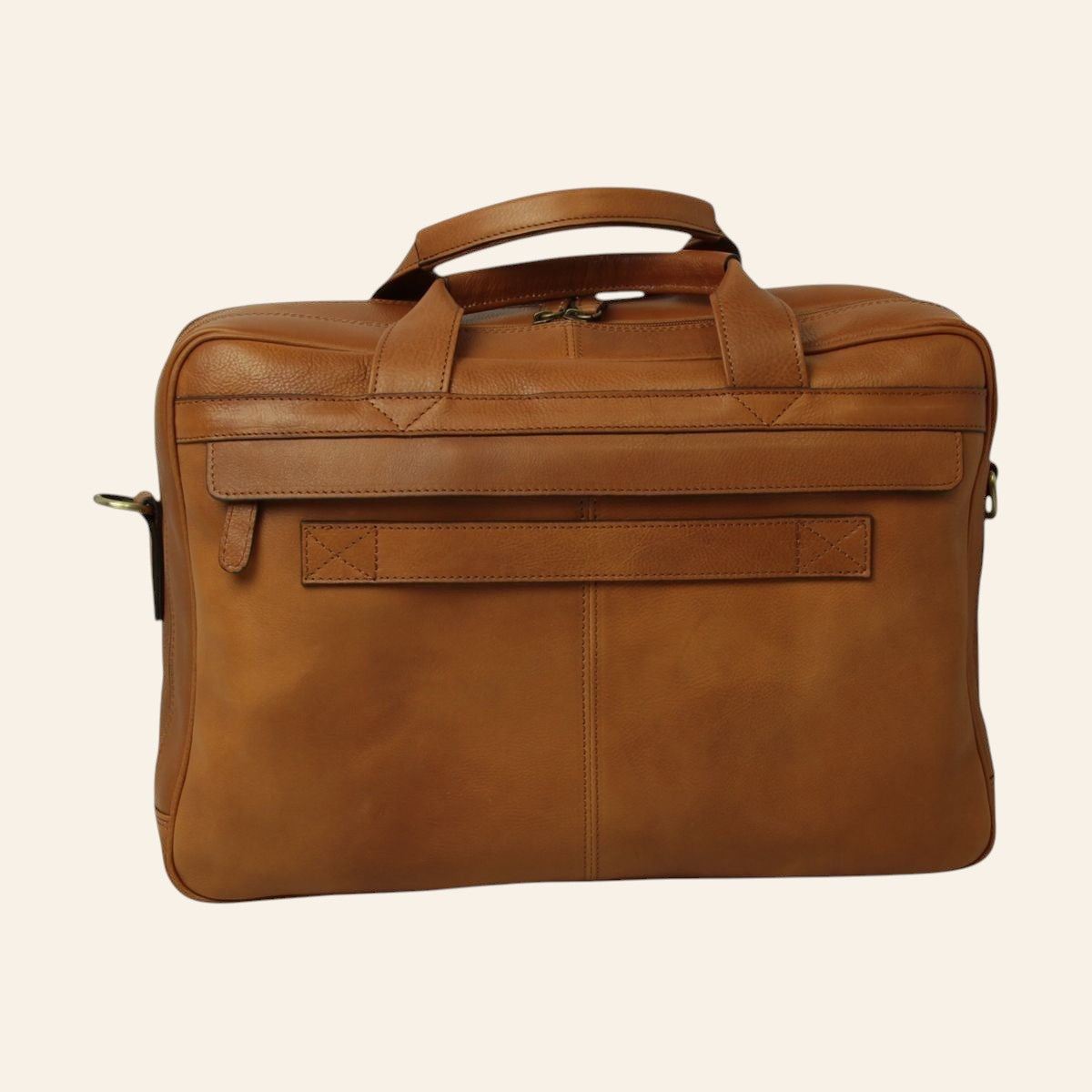 Borsa porta laptop in pelle color coloniale; vista posteriore con fascia per trolley, tasca posteriore con zip e due manici