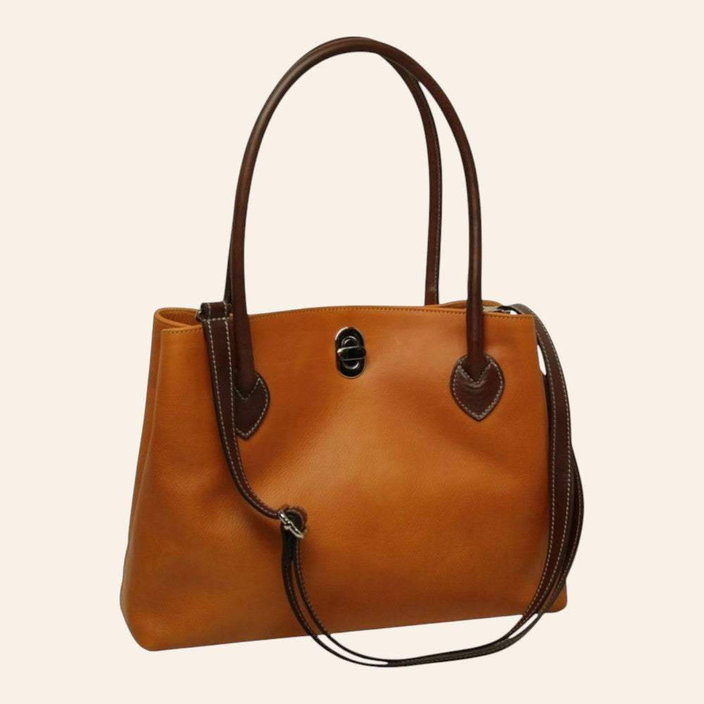 Tasche aus Vollnarbenleder in Ockergelb mit braunen Details und Drehverschluss