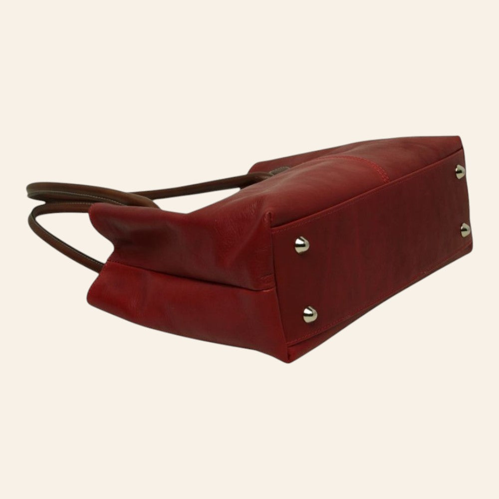 Borsa Vetrina Fiorentina artigianale in pelle pieno fiore rossa con piedini metallici, vista dal basso