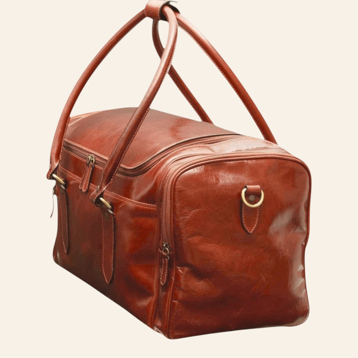 Borsa da viaggio Vetrina Fiorentina in pelle pieno fiore marrone, vista laterale con manici, anelli per la tracolla e tasche con zip