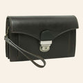 Clutch Vetrina Fiorentina in pelle pieno fiore nera con chiusura a chiave e cinturino da polso, design artigianale.