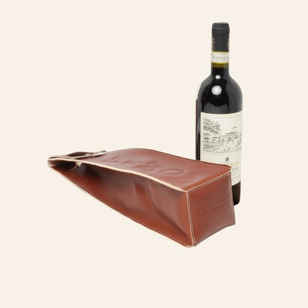 Portavino Vetrina Fiorentina in pelle di vacchetta pieno fiore color teak con cuciture a vista e manici integrati